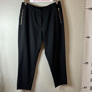 H&M black pull on trousers with zippered pockets. Size 14. Single back pocket.